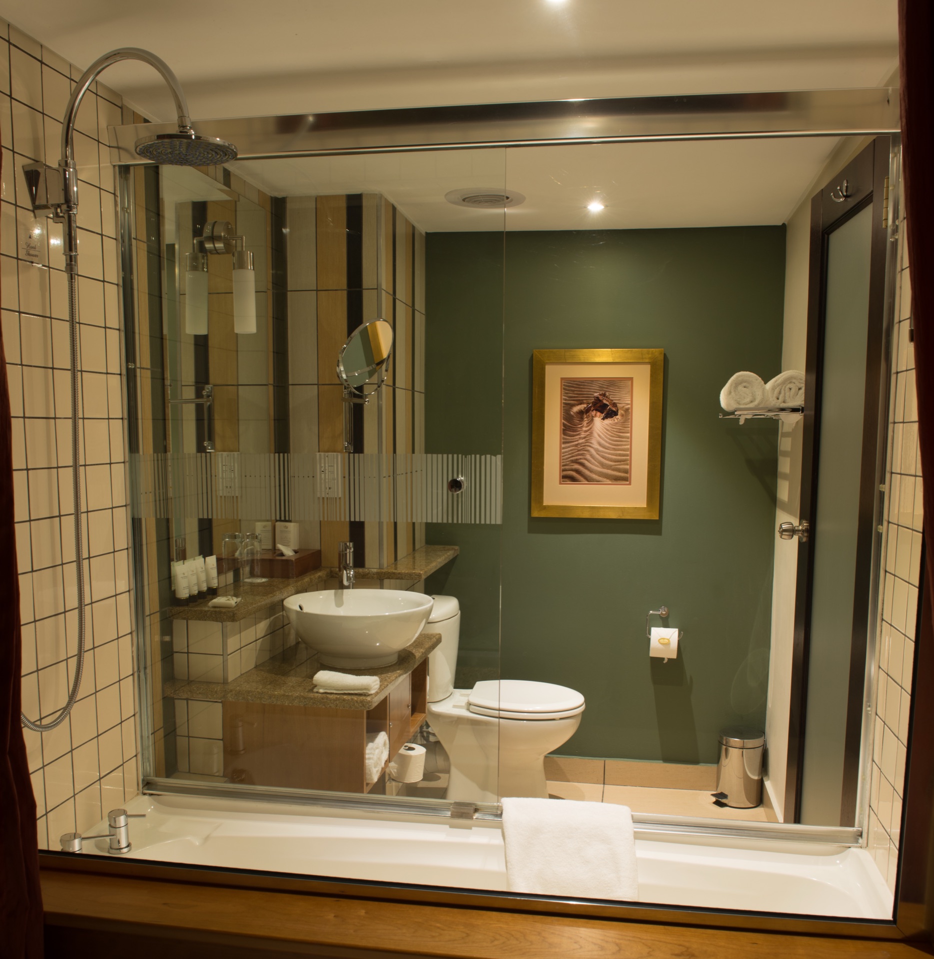 Classic room bathroom with rain shower over bath and vessel basin at the Walmont, The Grand Palm, Gaborone
