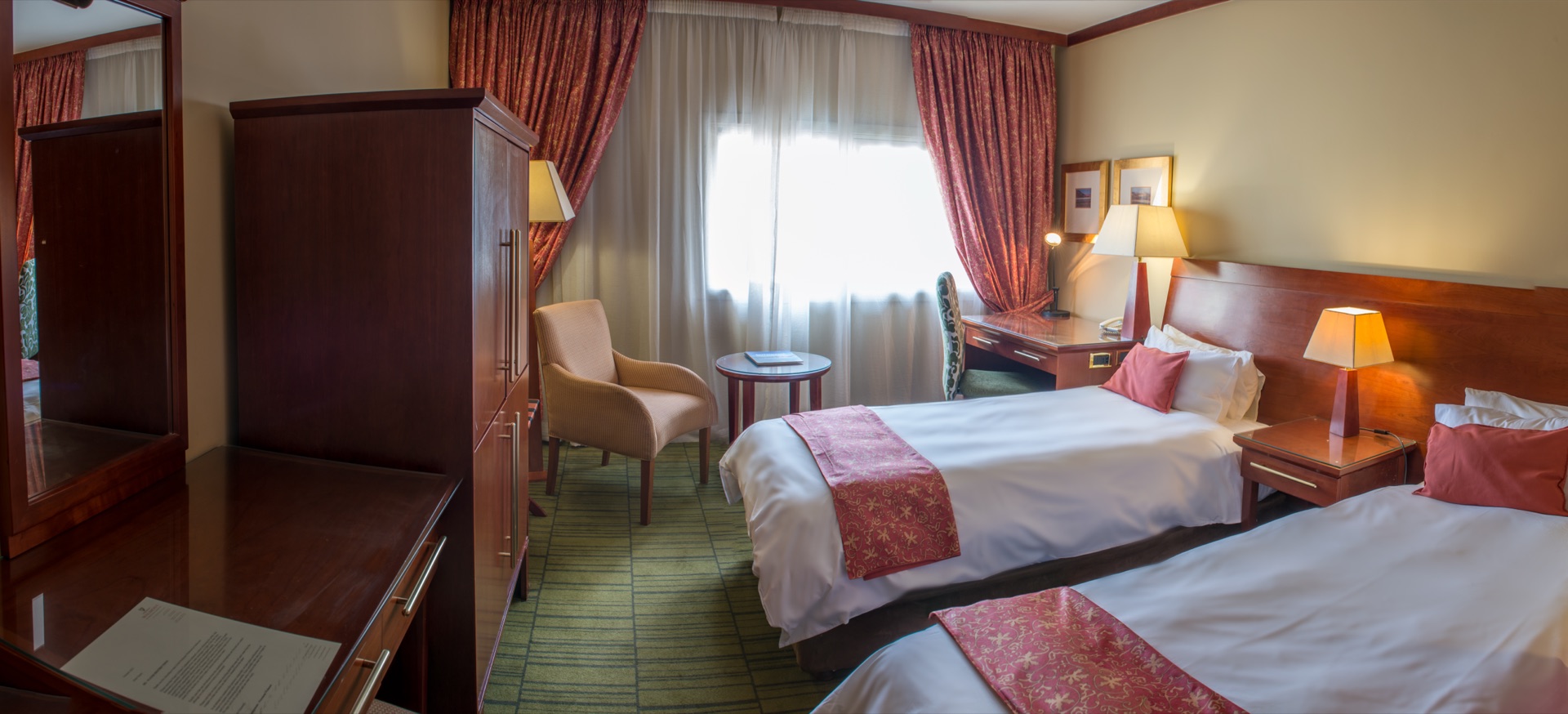 Classic Twin room with two beds, armchair and daylight window at the Walmont, The Grand Palm, Gaborone