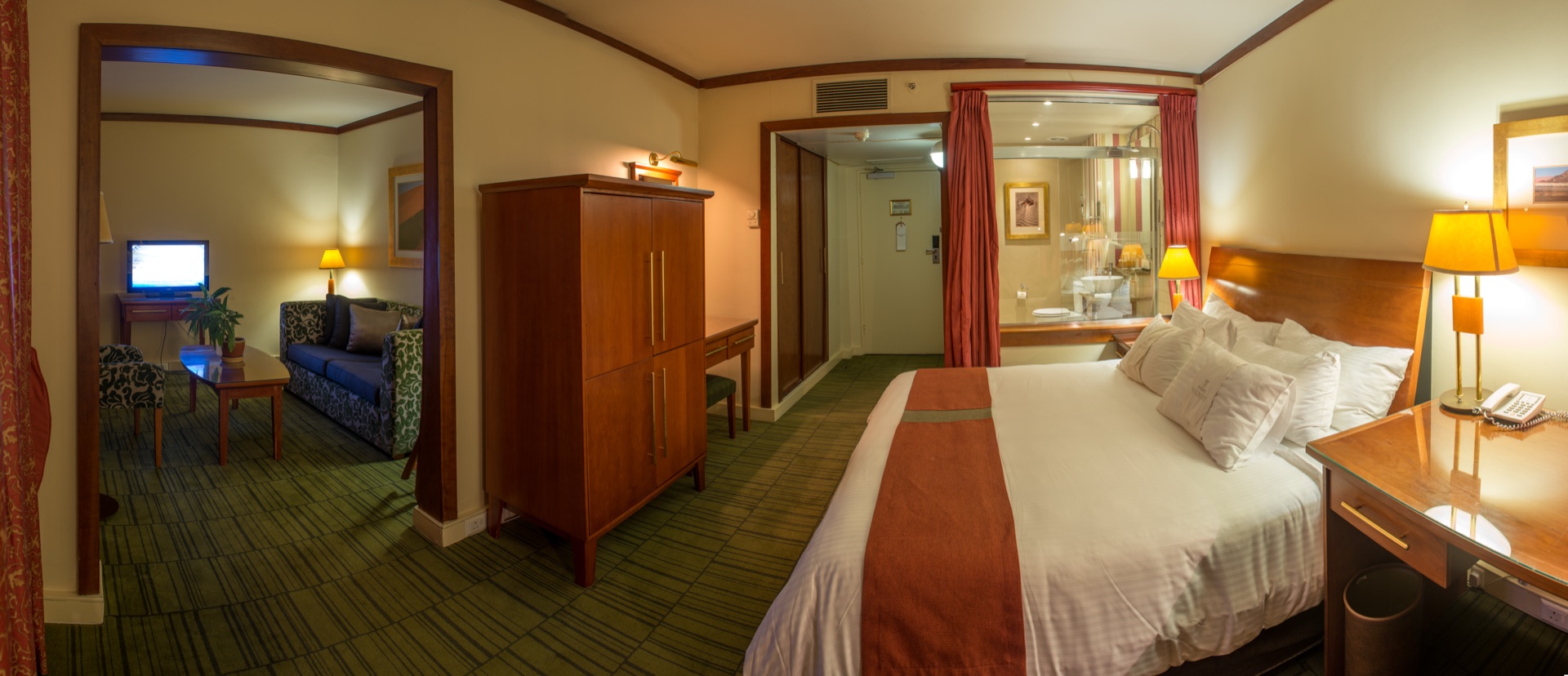 Executive Suite showing king bedroom opening onto a separate lounge at the Walmont, The Grand Palm, Gaborone